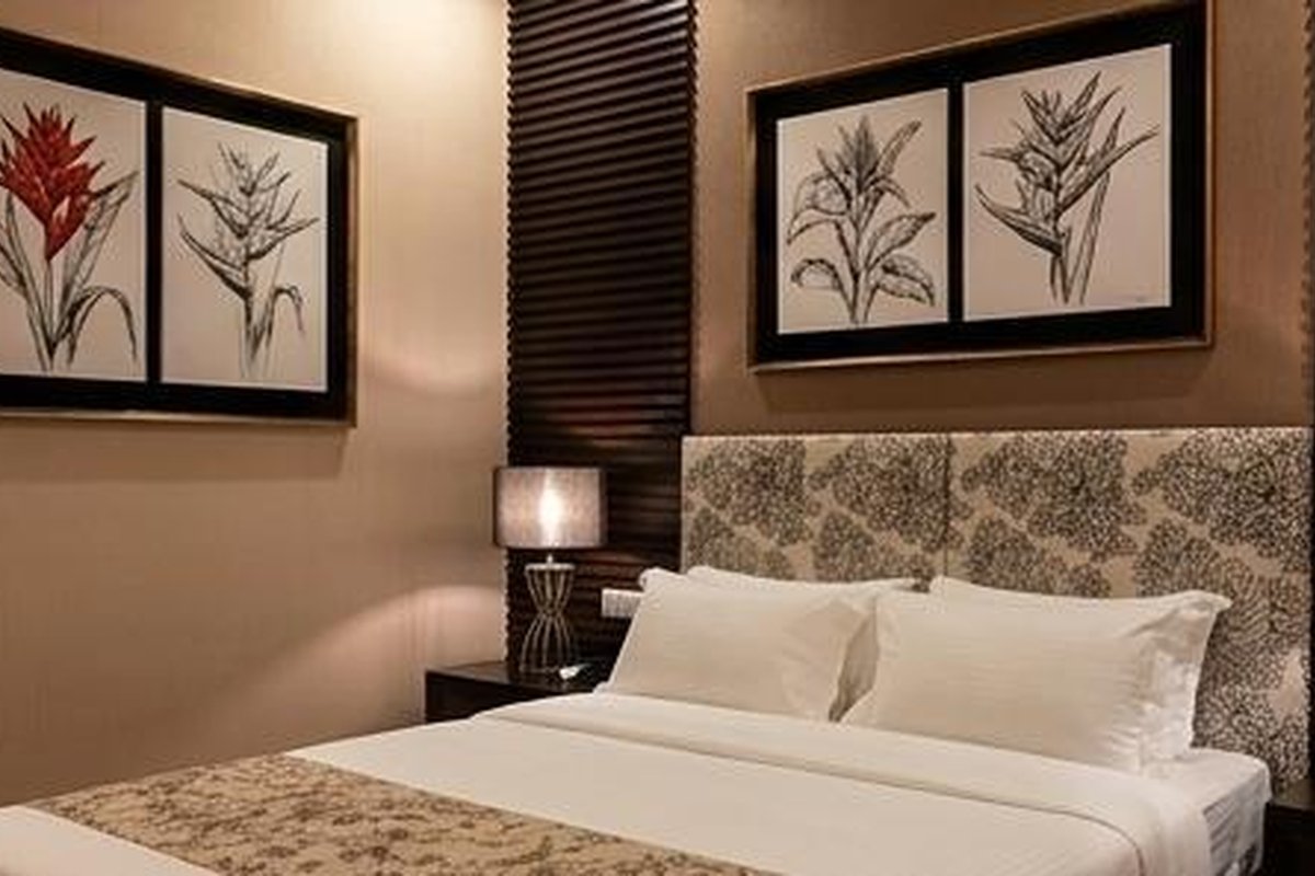 Bedroom with dark wood paneling and double bed